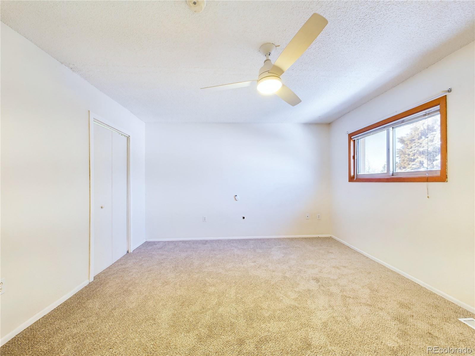 8770 Rainbow Avenue, Unit B4 Denver, CO 80229 - Photo 20 of 29 a view of room with window