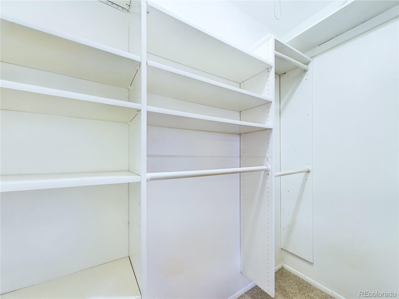 8770 Rainbow Avenue, Unit B4 Denver, CO 80229 - Photo 22 of 29 a view of an empty walk in closet