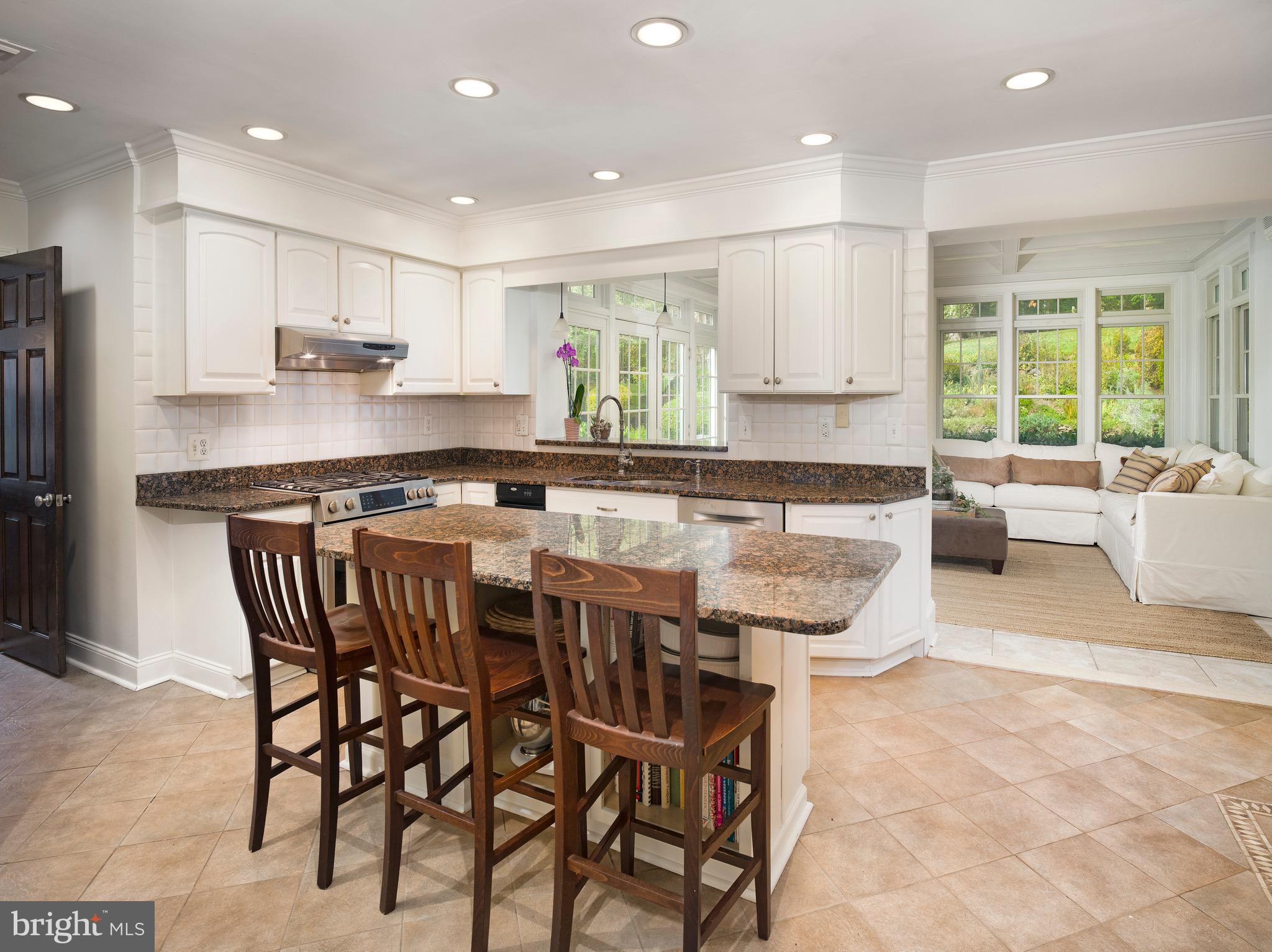 870 Goshen Road Newtown Square, PA 19073 - Photo 11 of 31 a kitchen with stainless steel appliances granite countertop a stove a sink and a refrigerator
