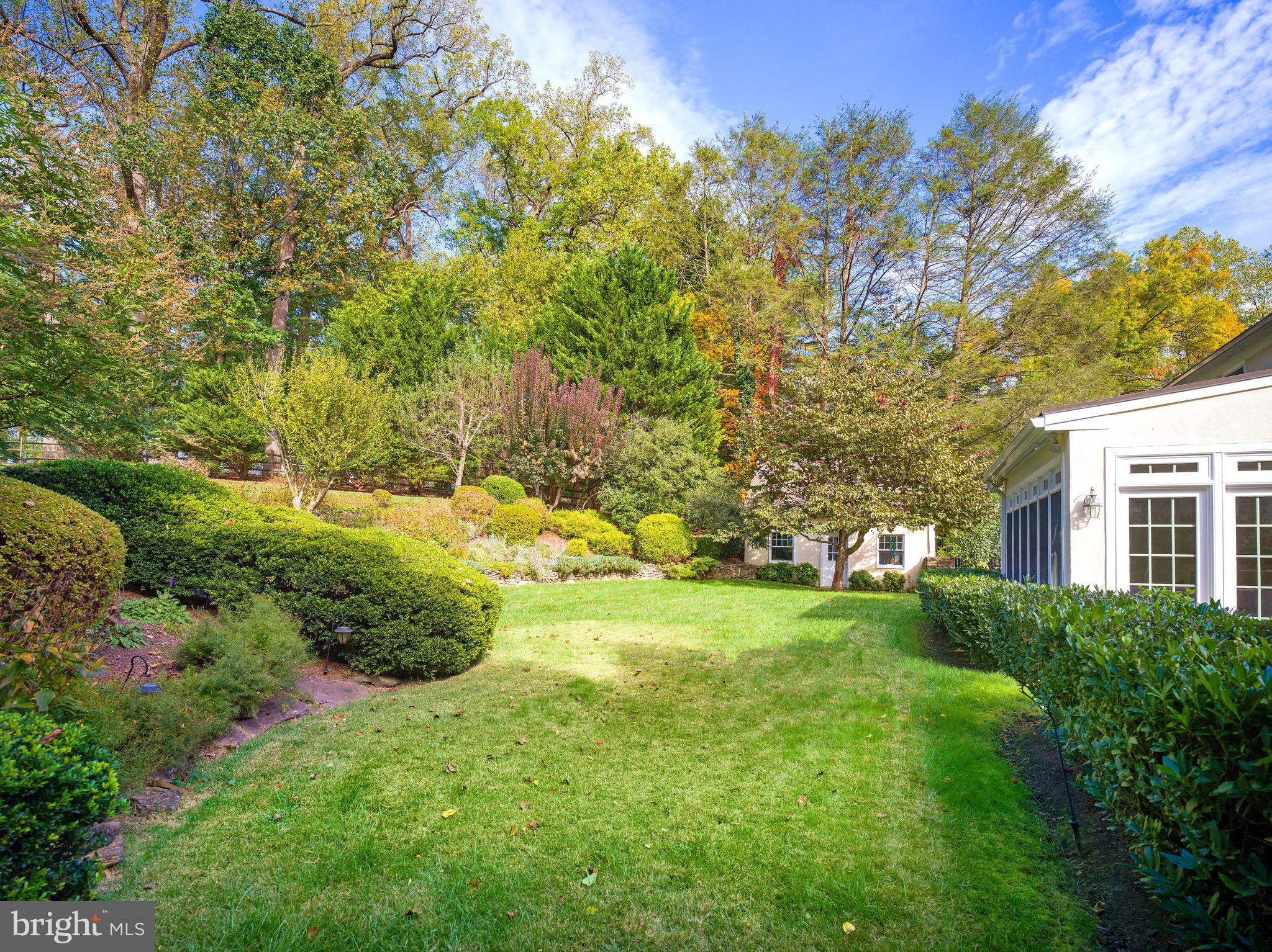 870 Goshen Road Newtown Square, PA 19073 - Photo 28 of 31 a view of a big yard with plants and large trees