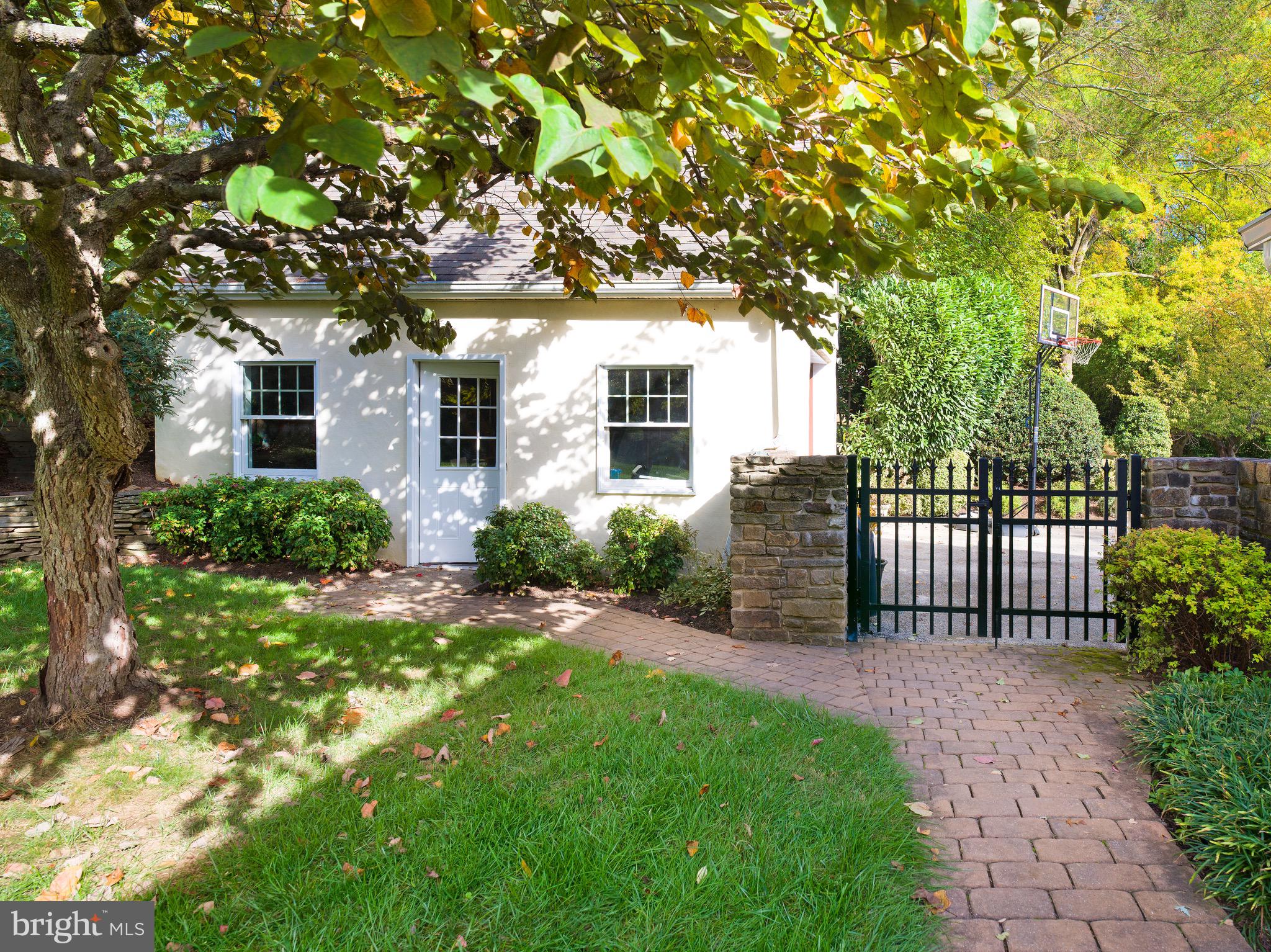 870 Goshen Road Newtown Square, PA 19073 - Photo 30 of 31 a front view of a house with a garden