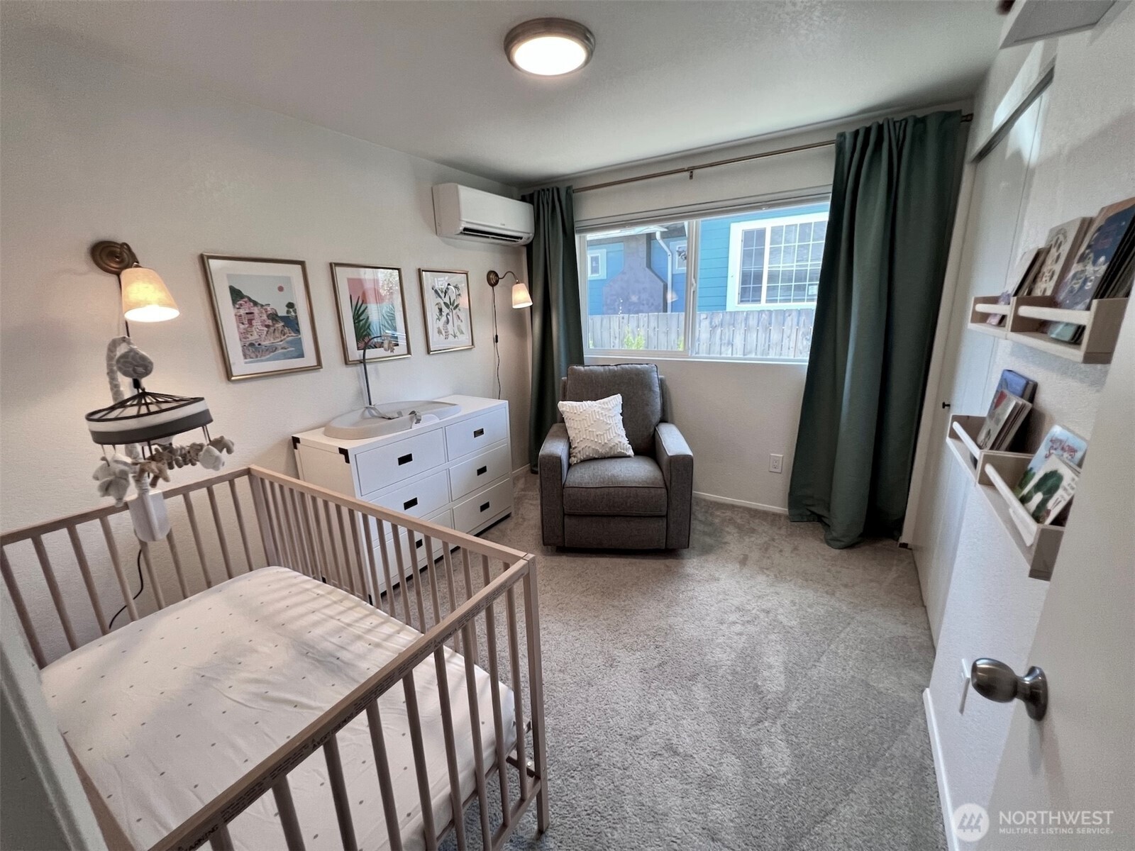 10201 17th Avenue Southwest Seattle, WA 98146 - Photo 11 of 27 a bedroom with furniture and a large window