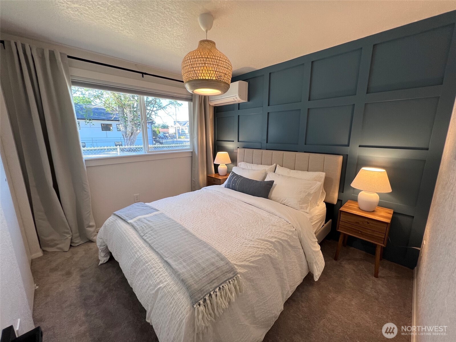 10201 17th Avenue Southwest Seattle, WA 98146 - Photo 19 of 27 a bedroom with a bed and a window