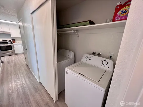 a view of storage and utility room with washer and dryer