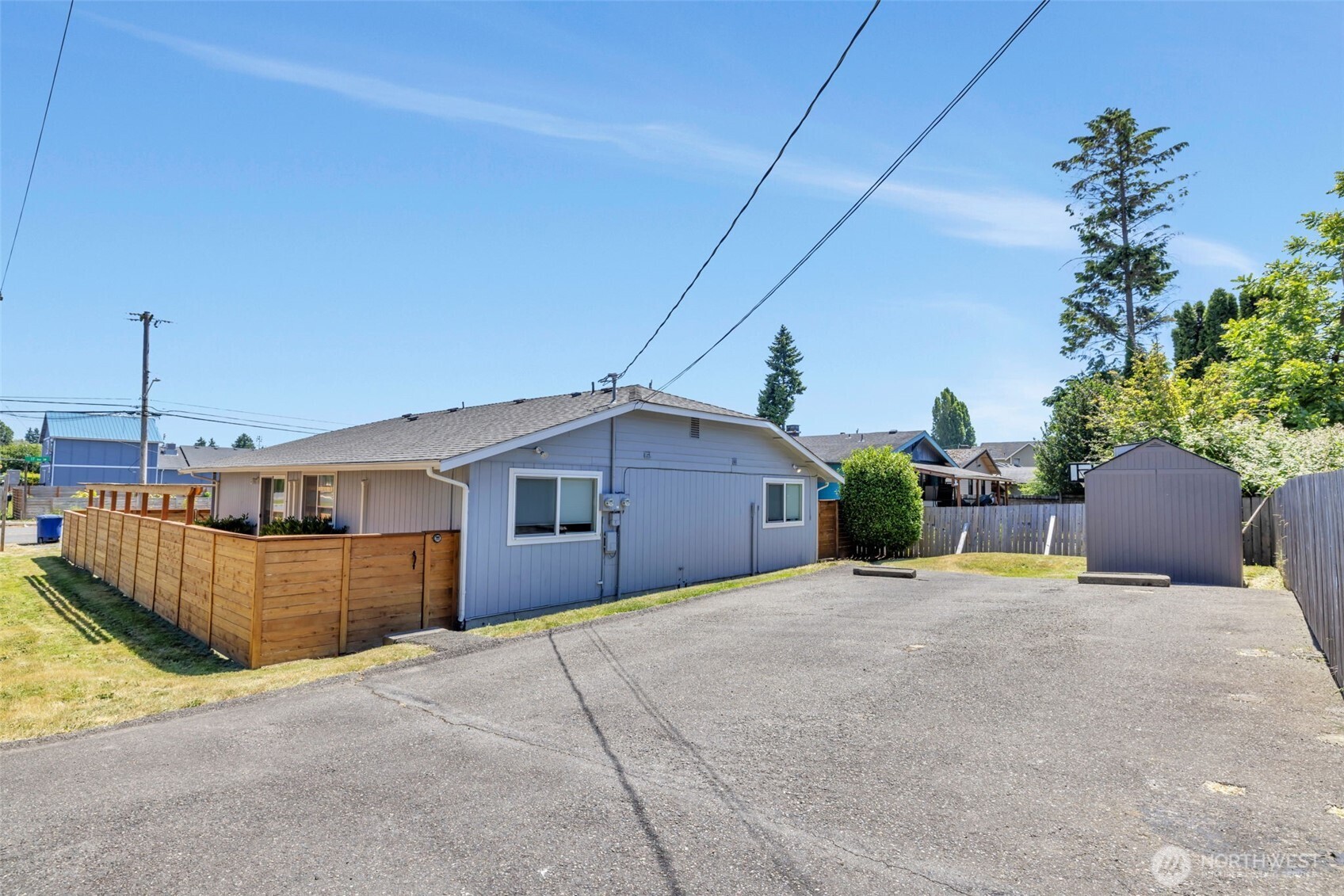 10201 17th Avenue Southwest Seattle, WA 98146 - Photo 23 of 27 a view of a house with a yard and sitting area