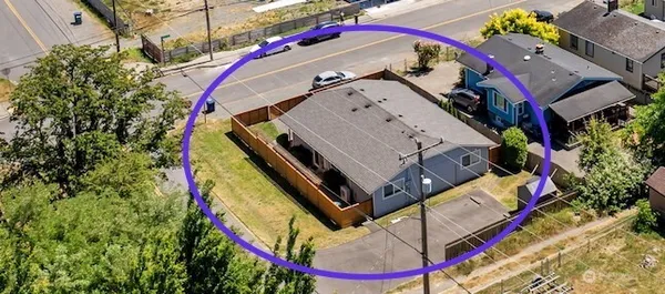 an aerial view of a house with a garden