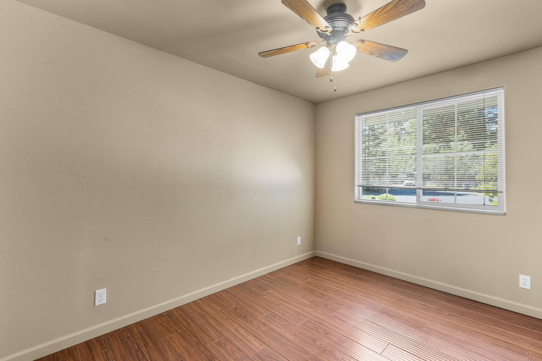 59842 Navajo Road Bend, OR 97702 - Photo 19 of 52 an empty room with a window and a fan