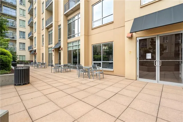 a kitchen with stainless steel appliances granite countertop a stove and white cabinets