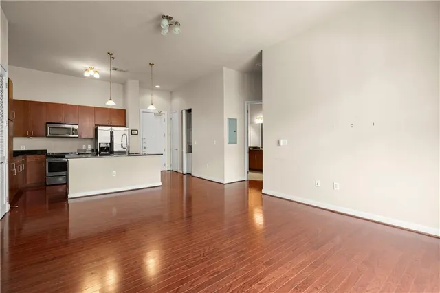a view of kitchen with cabinets and wooden floor