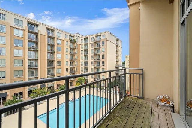 a view of balcony with wooden floor