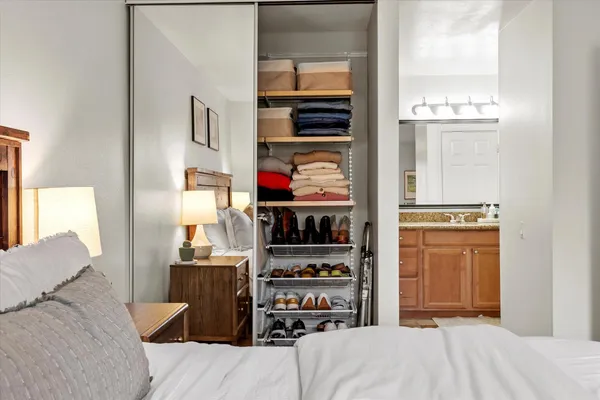 a bedroom with a bed and a cabinets