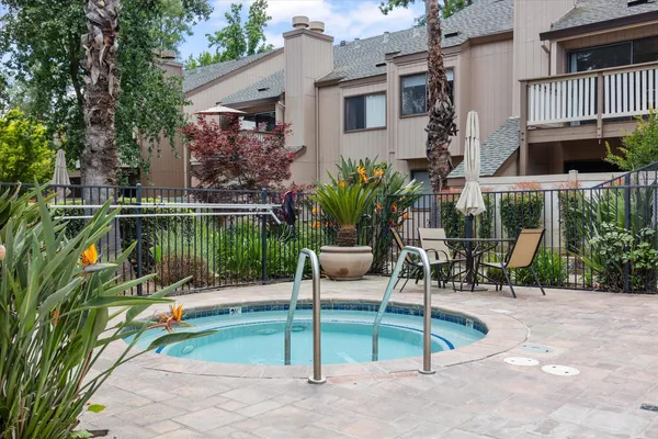 swimming pool with outdoor seating and yard