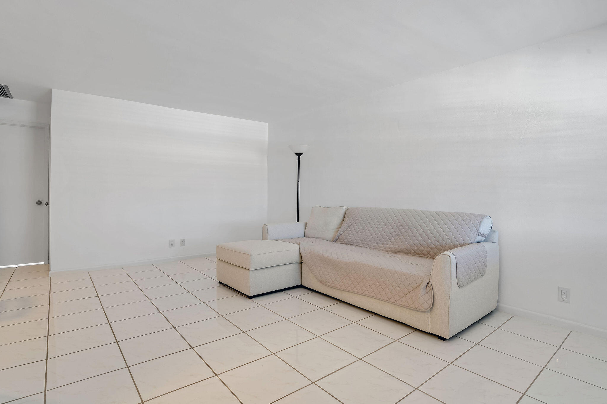 2050 Northeast 39th Street, Unit E307 Lighthouse Point, FL 33064 - Photo 18 of 42 a living room with furniture