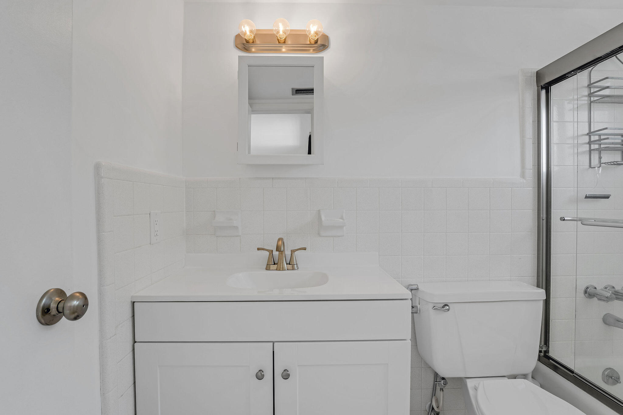 2050 Northeast 39th Street, Unit E307 Lighthouse Point, FL 33064 - Photo 28 of 42 a bathroom with a toilet and a sink