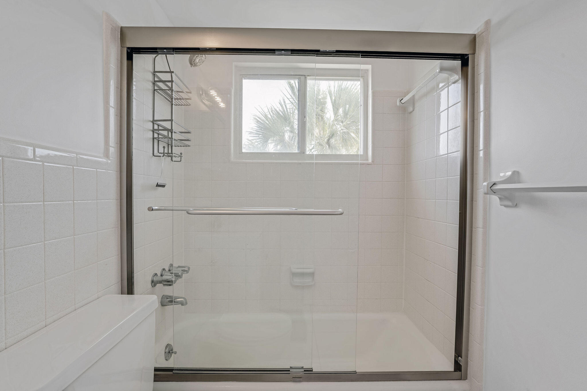 2050 Northeast 39th Street, Unit E307 Lighthouse Point, FL 33064 - Photo 29 of 42 a bathroom with a bathtub and a shower