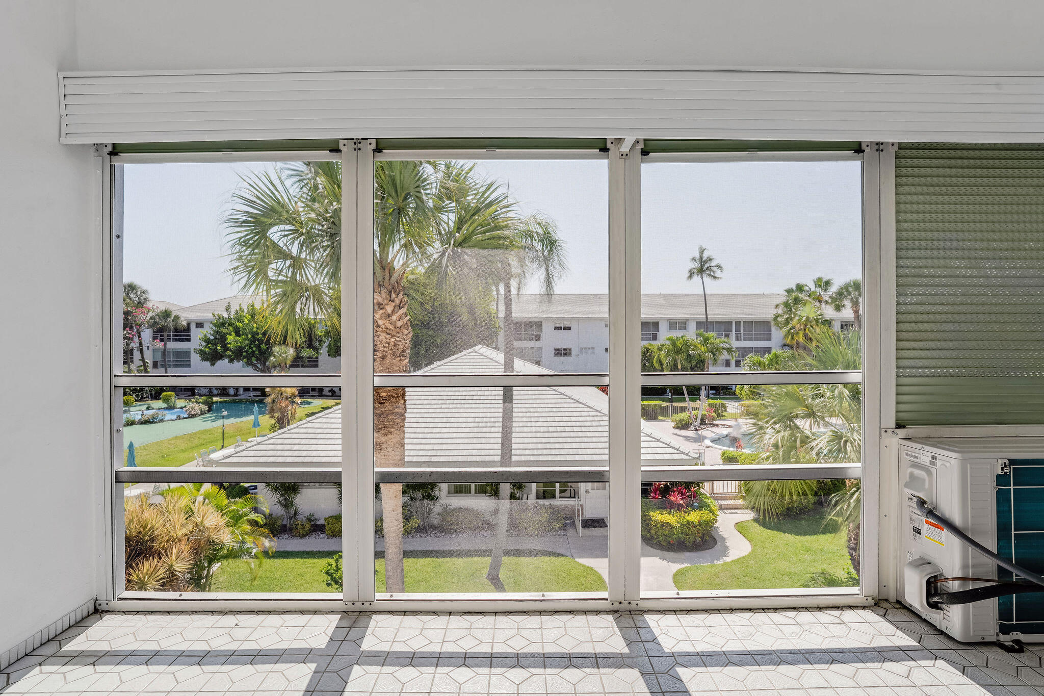 2050 Northeast 39th Street, Unit E307 Lighthouse Point, FL 33064 - Photo 32 of 42 a picture of a table and chairs