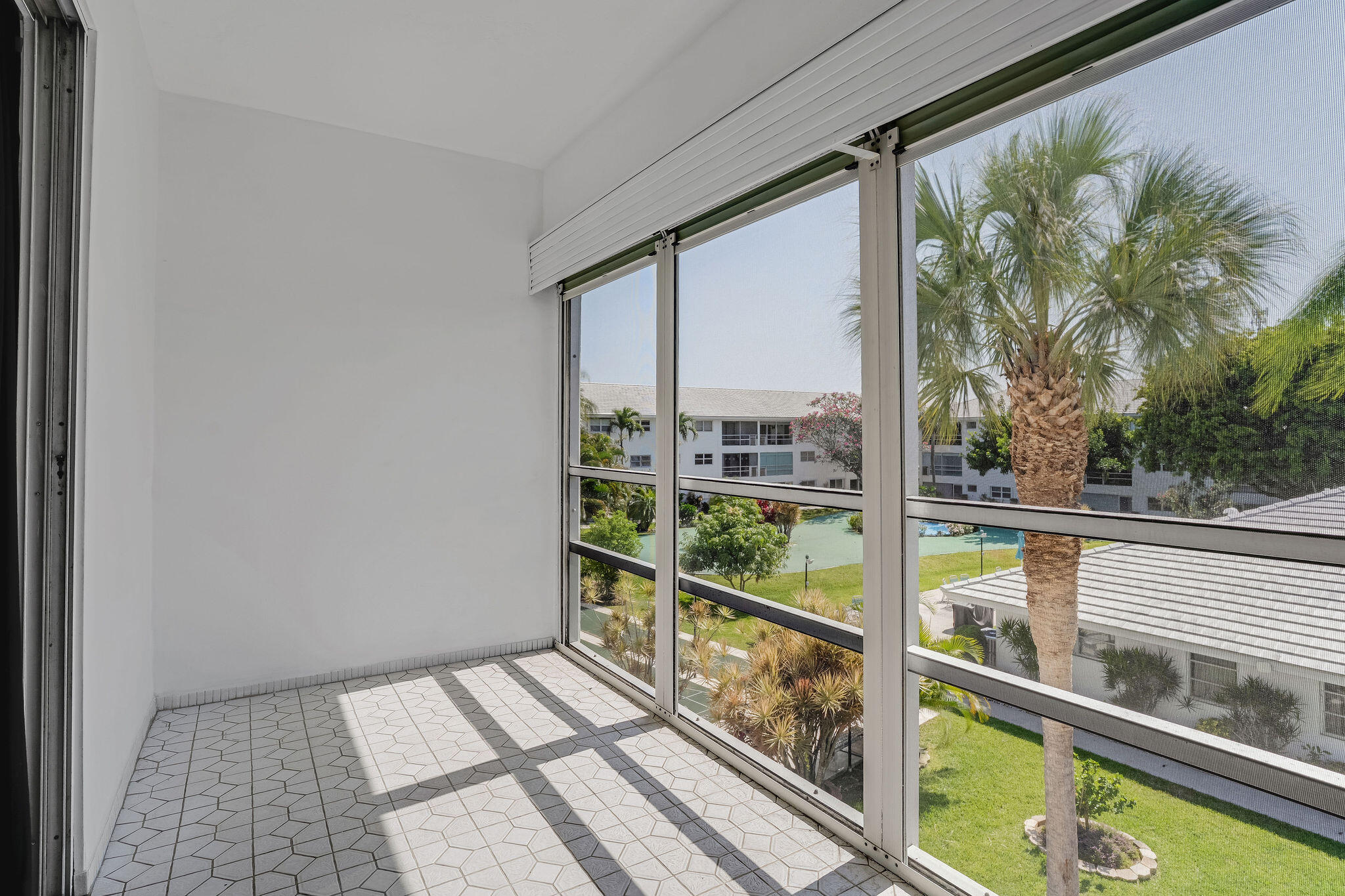 2050 Northeast 39th Street, Unit E307 Lighthouse Point, FL 33064 - Photo 33 of 42 a view of balcony with wooden floor