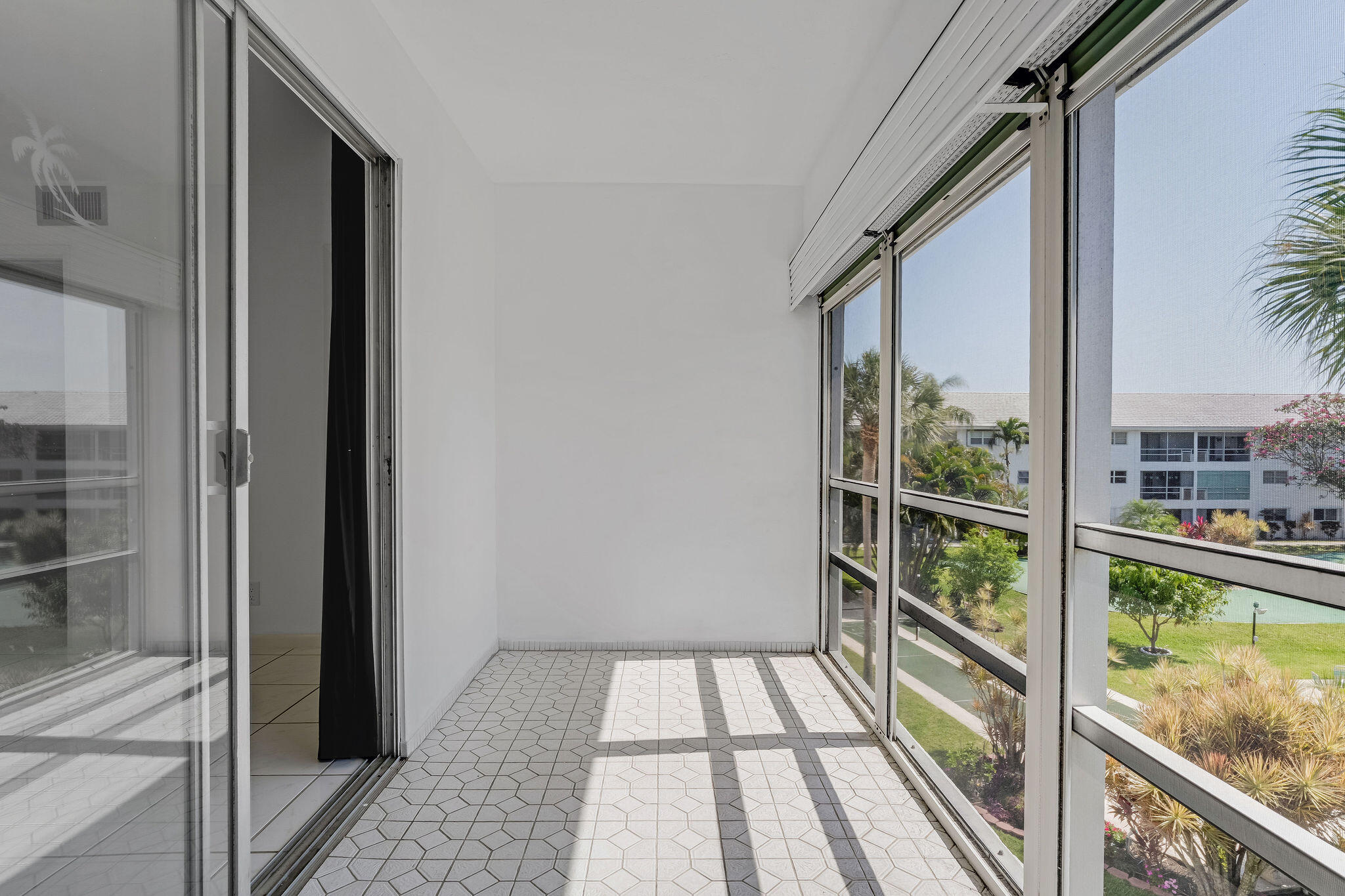 2050 Northeast 39th Street, Unit E307 Lighthouse Point, FL 33064 - Photo 34 of 42 a view of a balcony and wooden floor