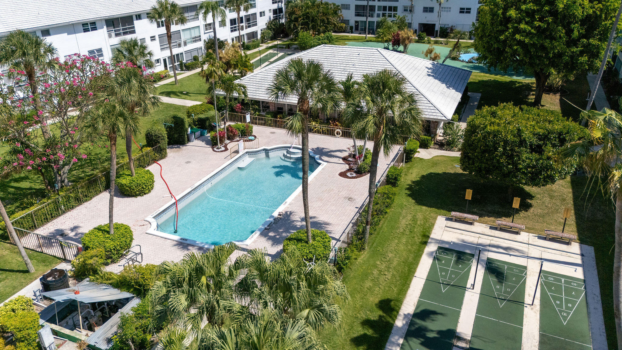 2050 Northeast 39th Street, Unit E307 Lighthouse Point, FL 33064 - Photo 38 of 42 an aerial view of a house with a yard