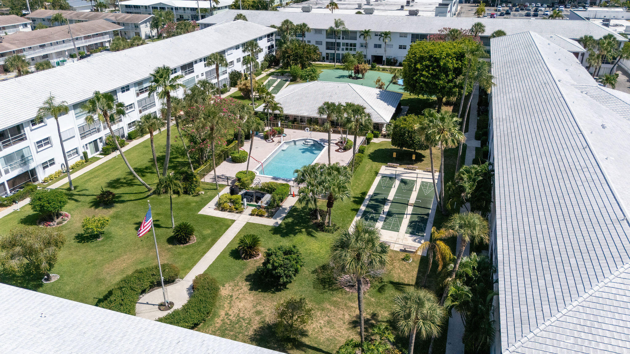 2050 Northeast 39th Street, Unit E307 Lighthouse Point, FL 33064 - Photo 39 of 42 an aerial view of residential house with outdoor space and trees all around