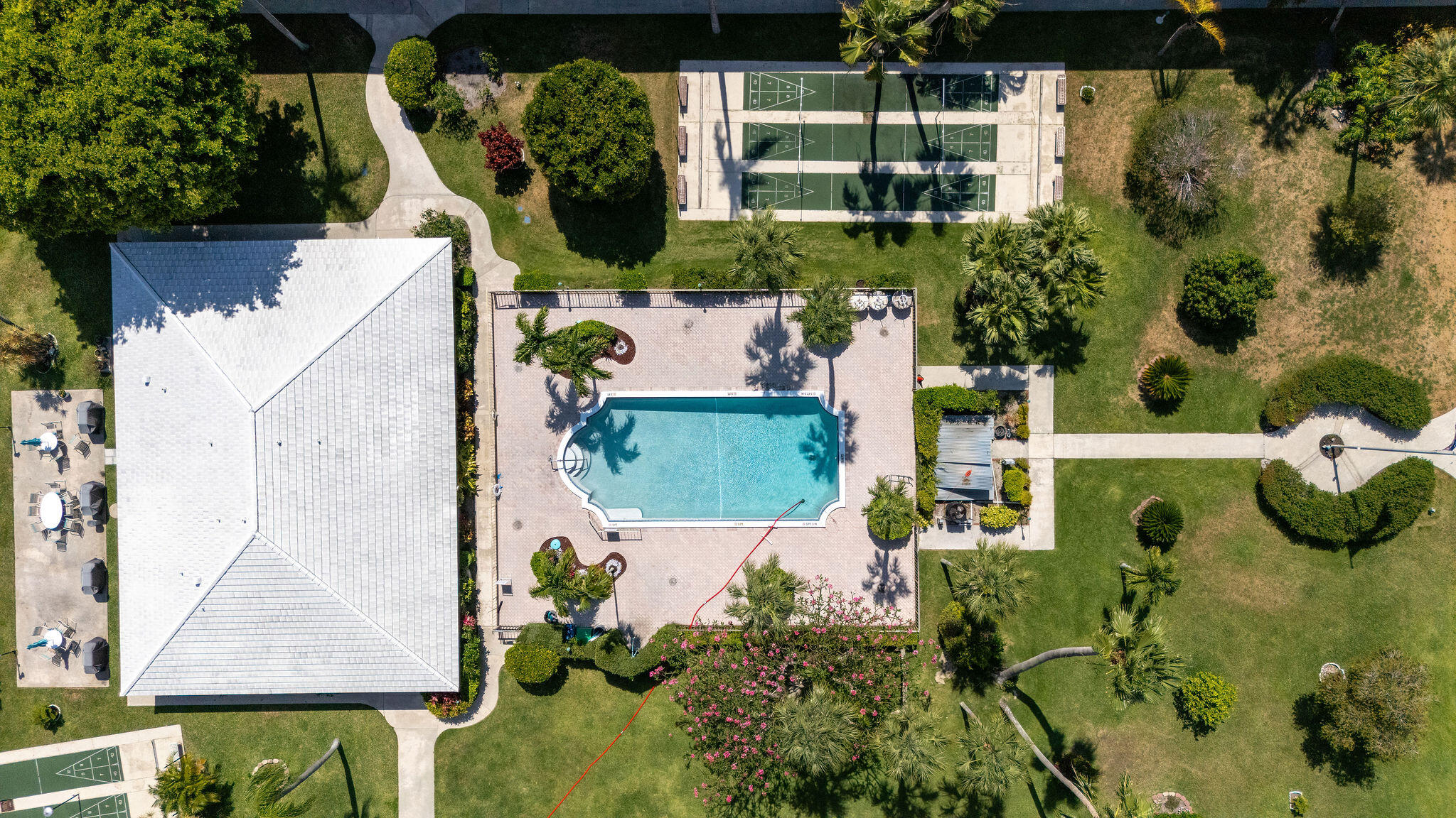 2050 Northeast 39th Street, Unit E307 Lighthouse Point, FL 33064 - Photo 41 of 42 an aerial view of a house with a yard and garden