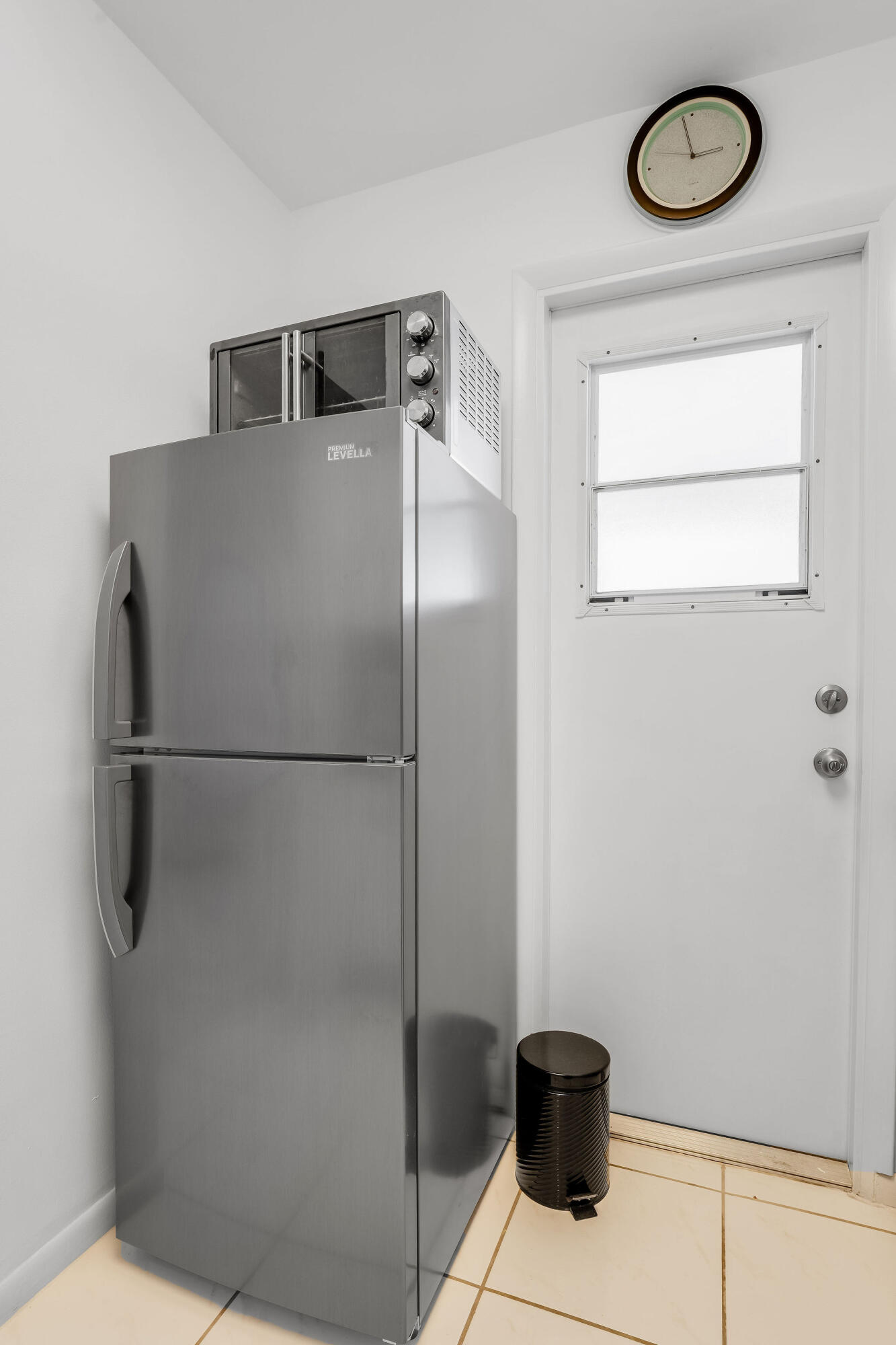 2050 Northeast 39th Street, Unit E307 Lighthouse Point, FL 33064 - Photo 5 of 42 a close view of a refrigerator a washer and dryer