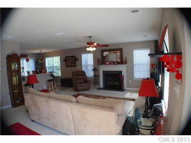 155 Mott Road Mooresville, NC 28115 - Photo 2 of 9 a living room with furniture and a fireplace