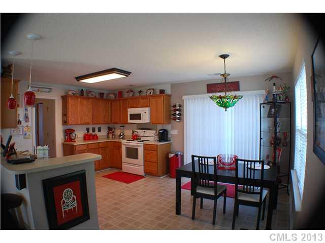 155 Mott Road Mooresville, NC 28115 - Photo 3 of 9 a view of a dining room with furniture
