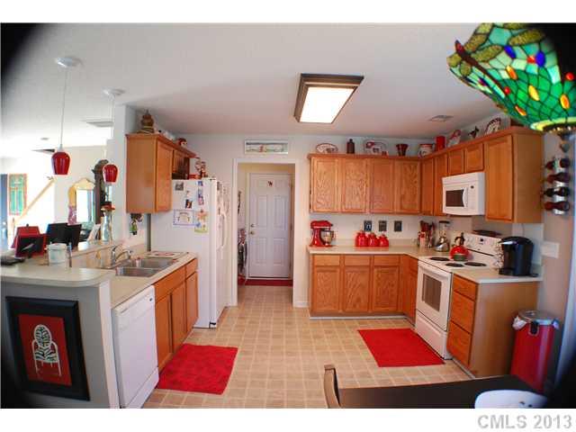 155 Mott Road Mooresville, NC 28115 - Photo 4 of 9 a kitchen with stove and cabinets