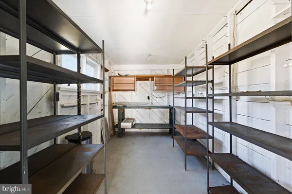 a view of an empty room with windows