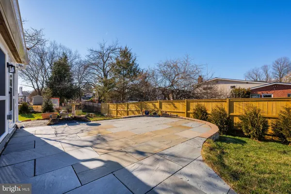 a view of a swimming pool with an outdoor seating