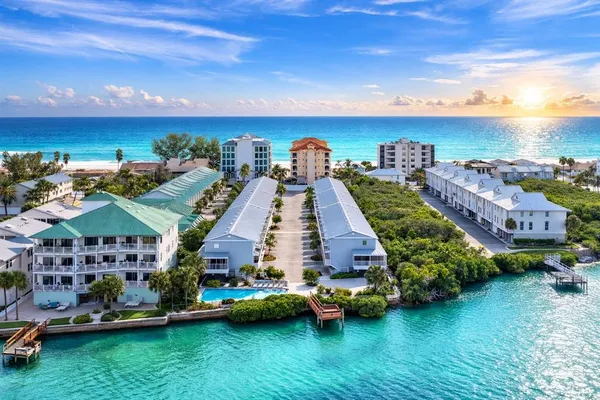 a potted plant sitting on the side of a brick house