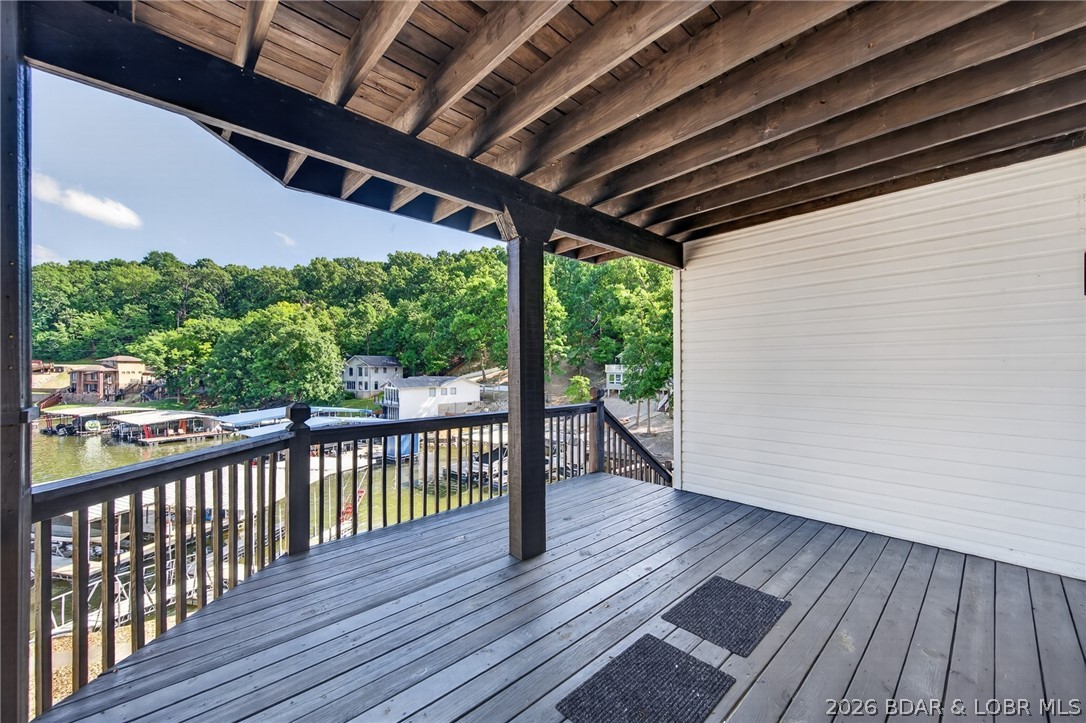 25 Old Sassafrass Road Eldon, MO 65026 - Photo 47 of 58 Lower level deck and stairs down to the dock.