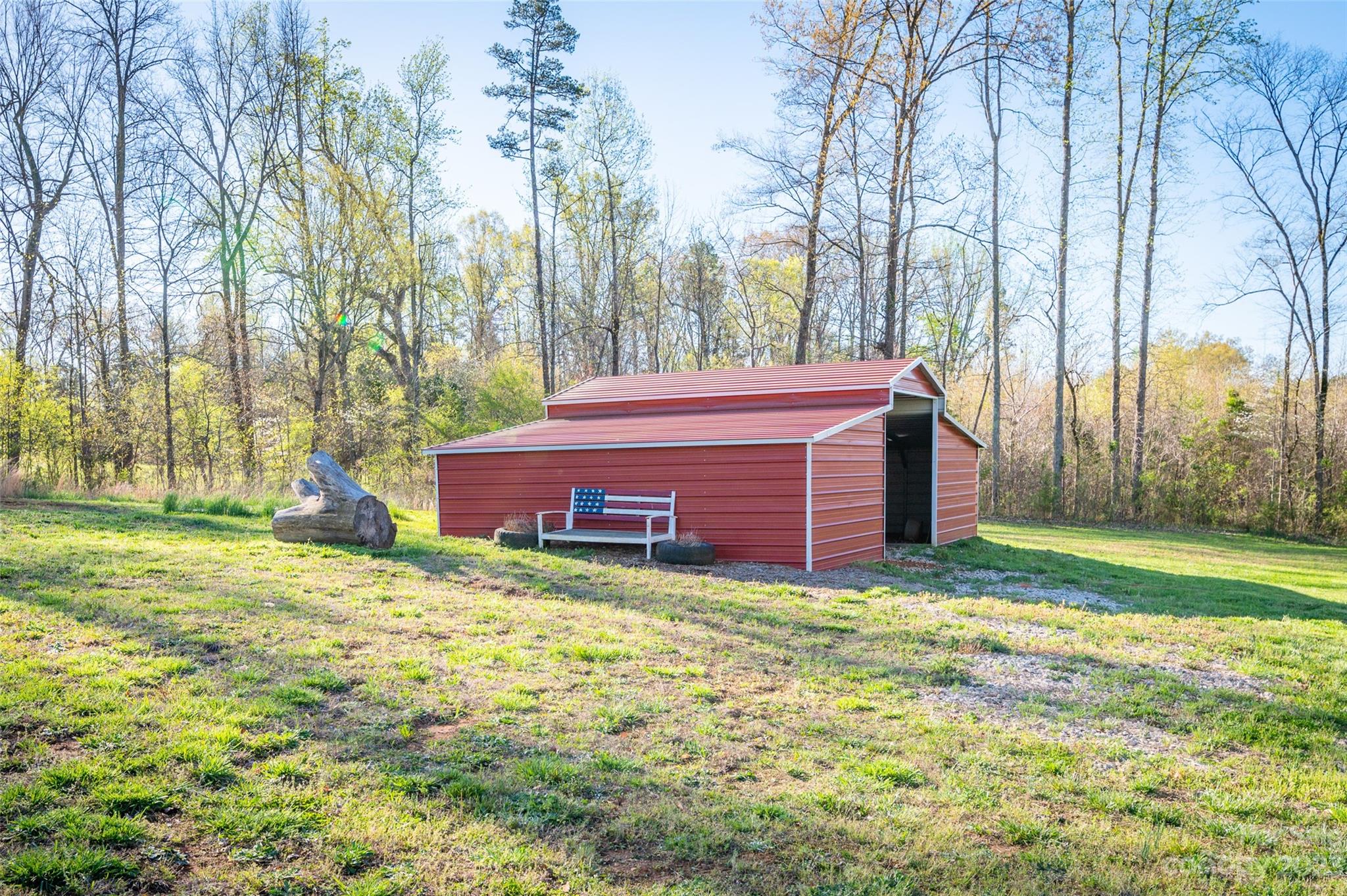 740 Renshaw Ford Road Woodleaf, NC 27054 - Photo 11 of 33 a view of a backyard with large trees