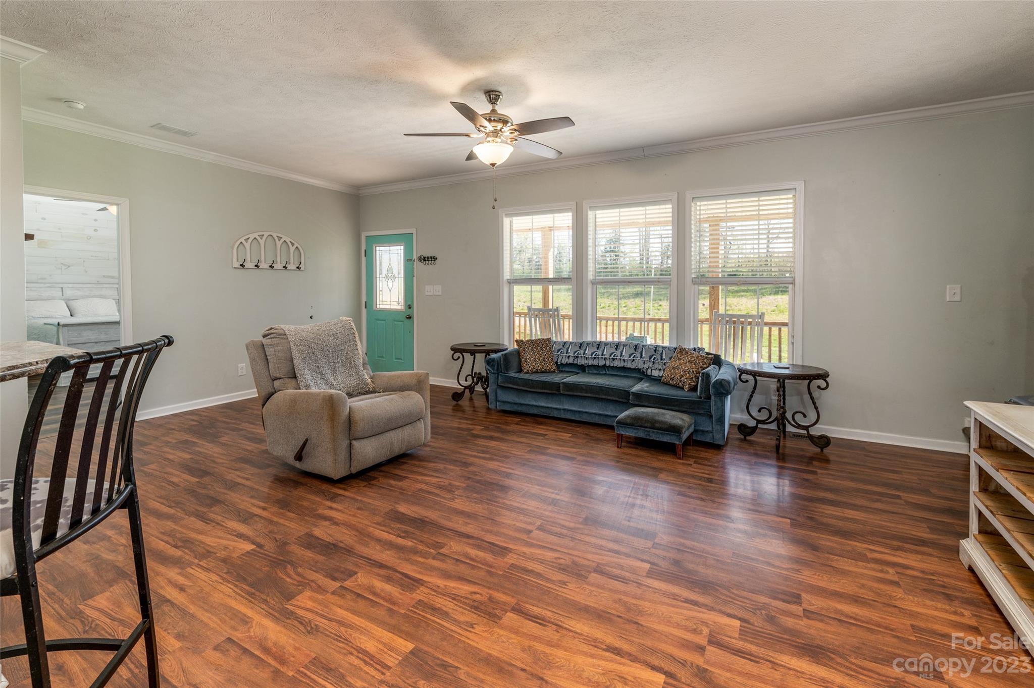 740 Renshaw Ford Road Woodleaf, NC 27054 - Photo 14 of 33 a living room with furniture and a large window
