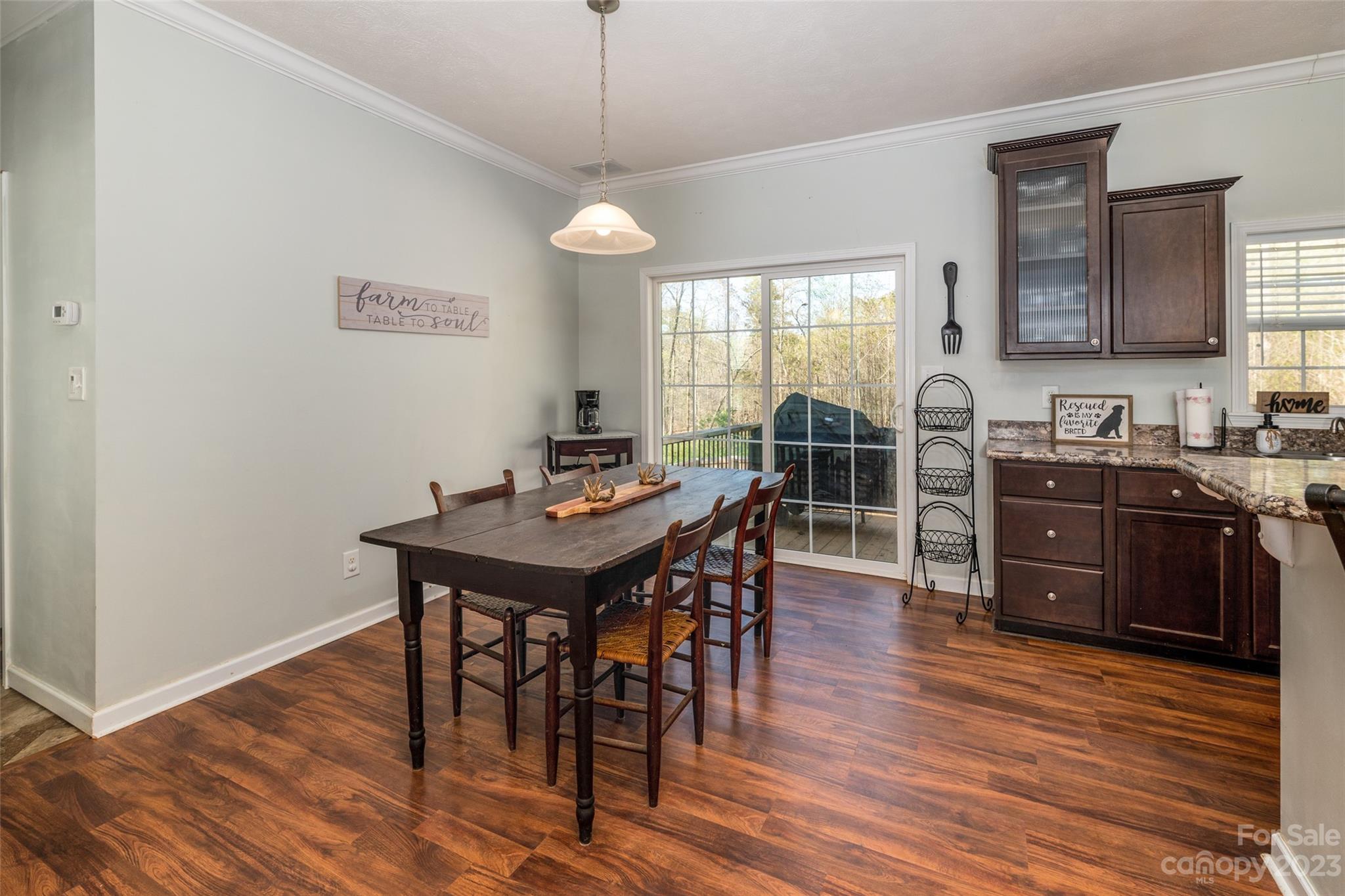740 Renshaw Ford Road Woodleaf, NC 27054 - Photo 17 of 33 a view of a dining room with furniture window and wooden floor