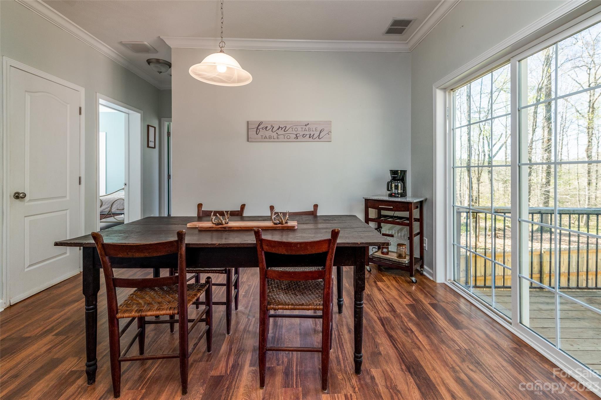 740 Renshaw Ford Road Woodleaf, NC 27054 - Photo 18 of 33 a view of a dining room with furniture window and wooden floor