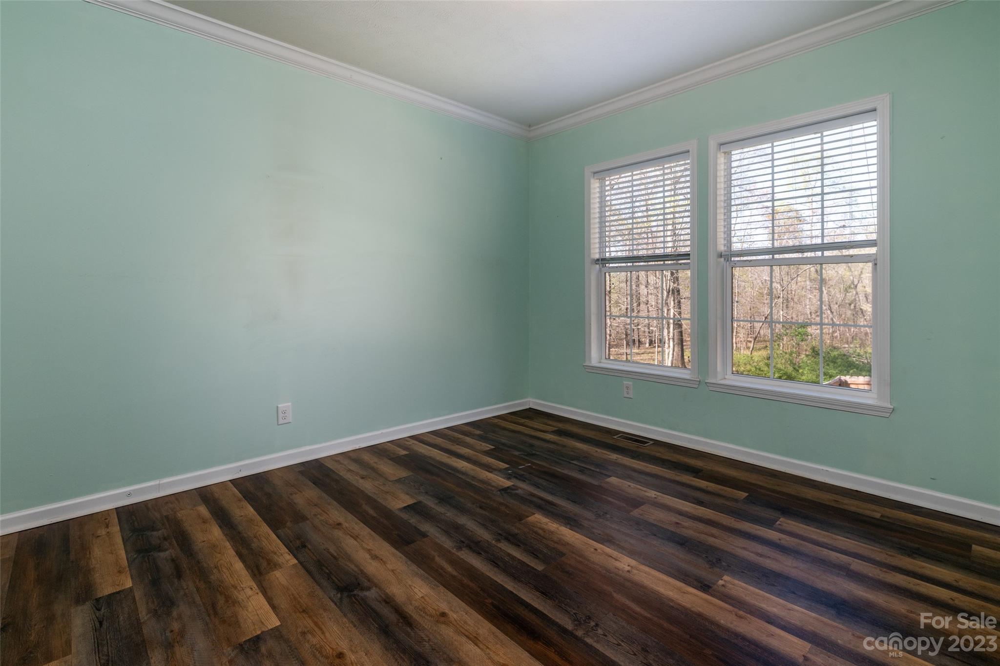 740 Renshaw Ford Road Woodleaf, NC 27054 - Photo 24 of 33 a view of a room with wooden floor and windows