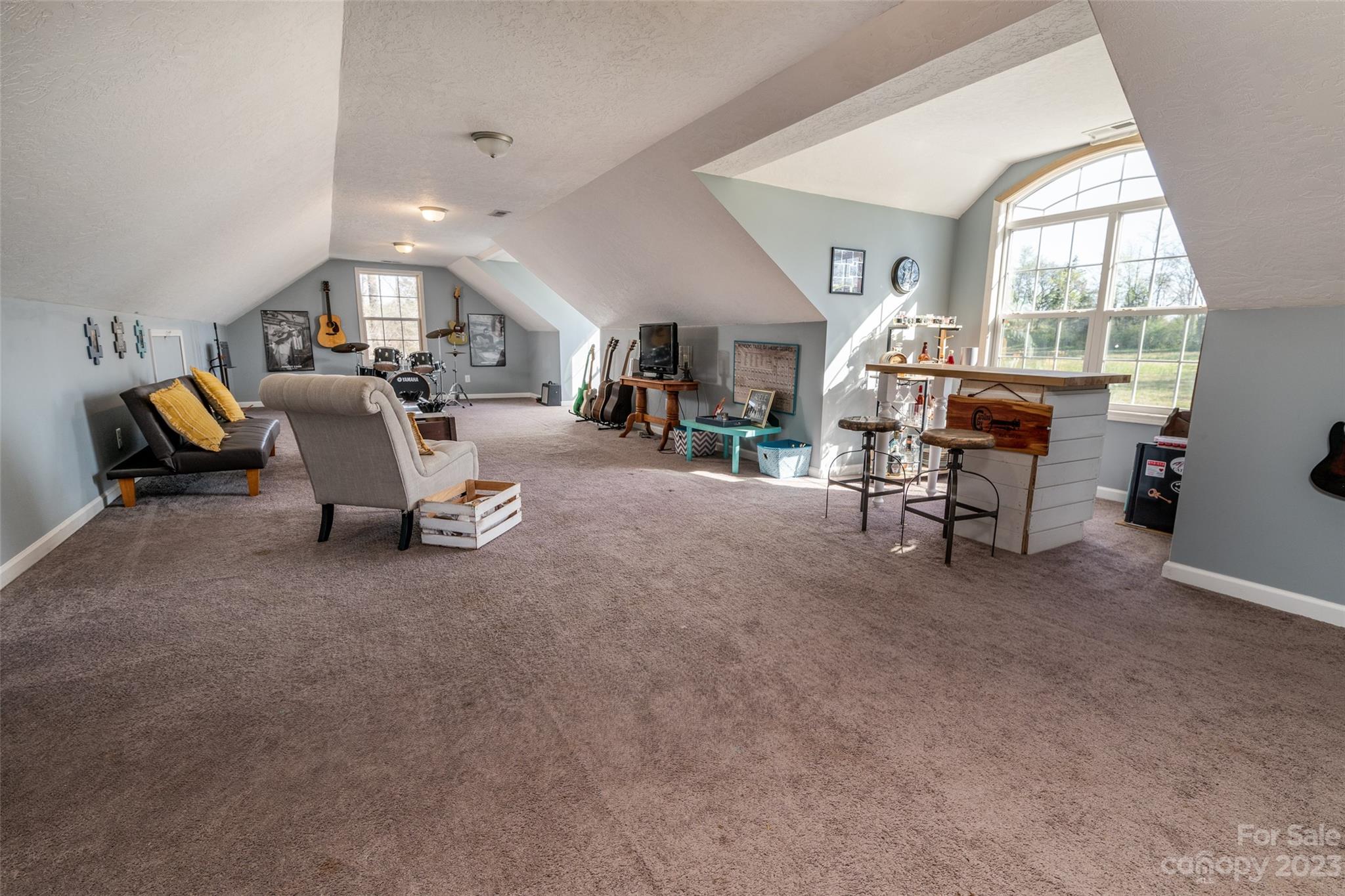 740 Renshaw Ford Road Woodleaf, NC 27054 - Photo 27 of 33 a living room with furniture and a large window