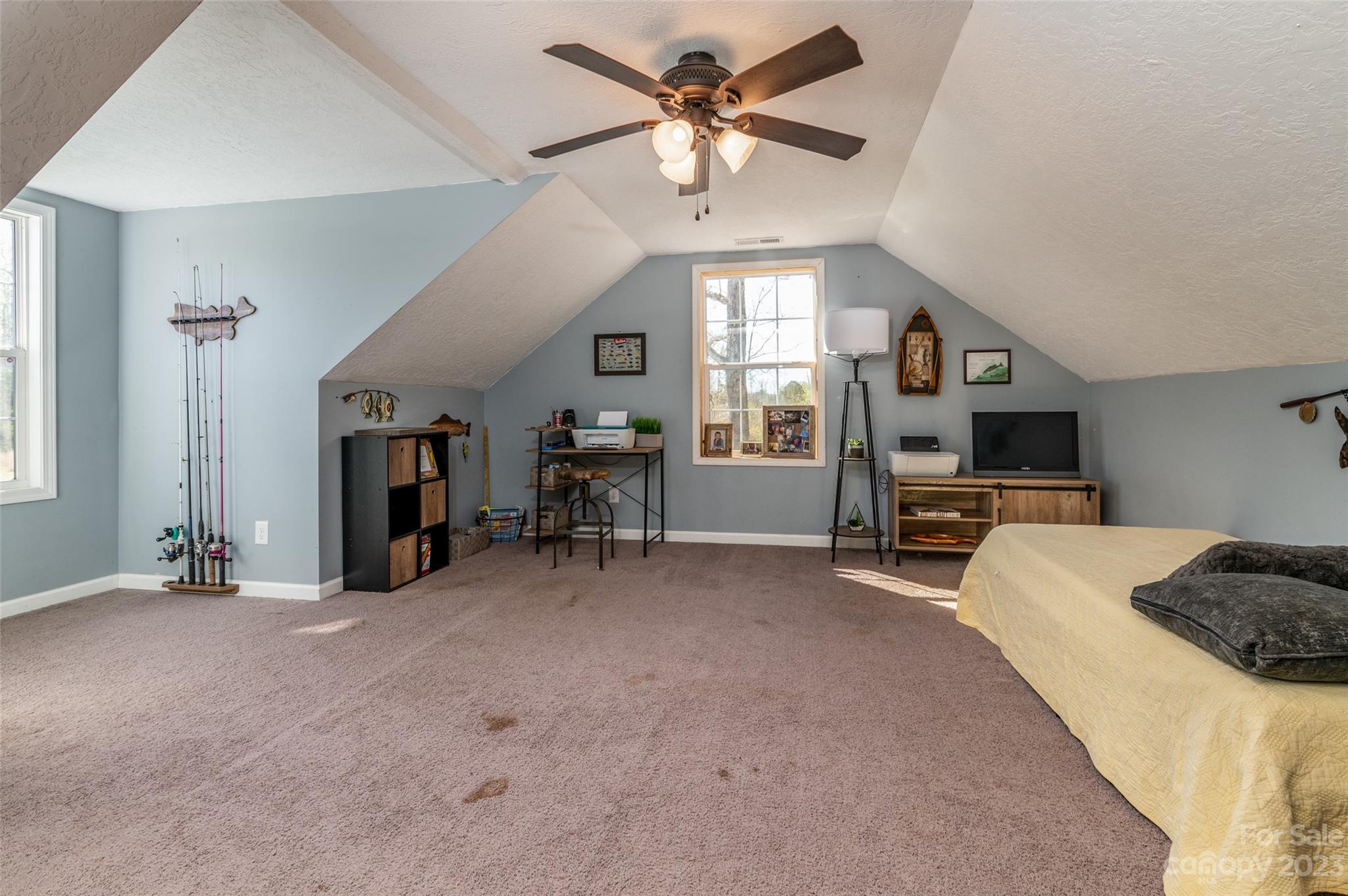740 Renshaw Ford Road Woodleaf, NC 27054 - Photo 28 of 33 a living room with furniture and a flat screen tv
