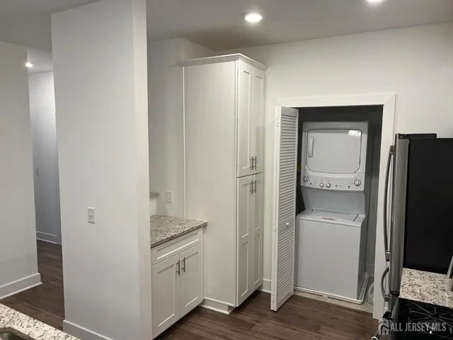 a kitchen with a refrigerator and cabinets