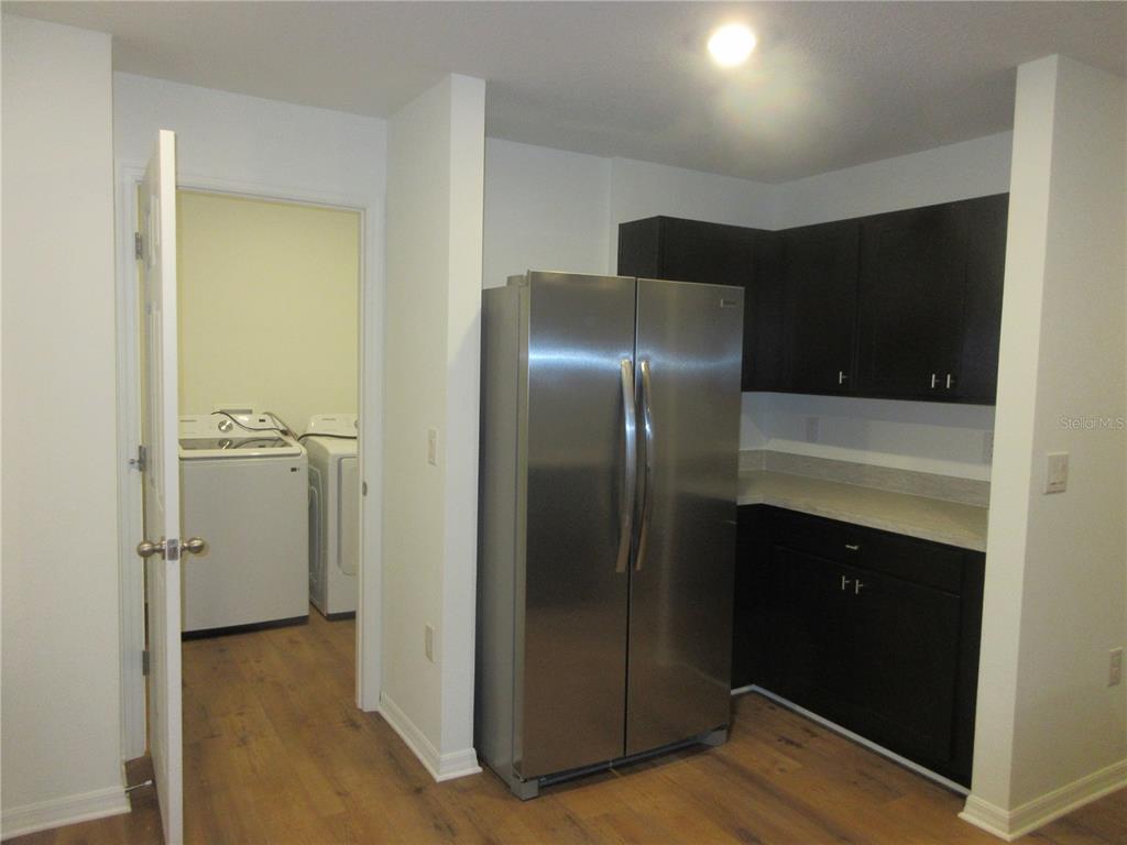 13130 Southwest 78th Circle Ocala, FL 34473 - Photo 3 of 14 a kitchen with a refrigerator and a sink