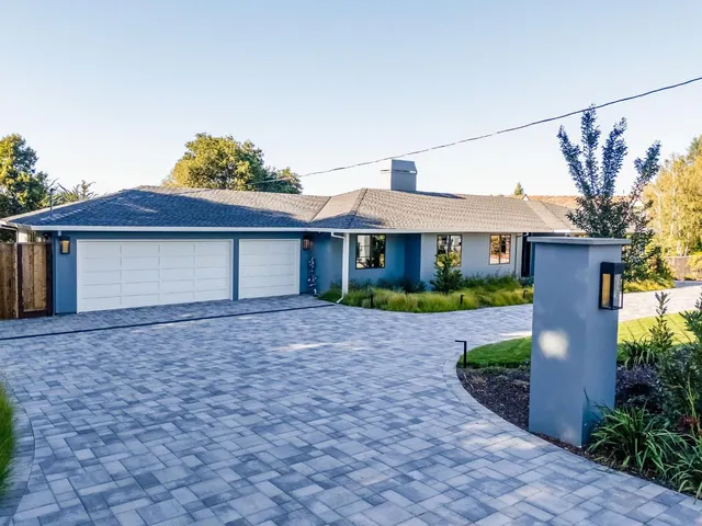 a view of house with swimming pool outdoor seating
