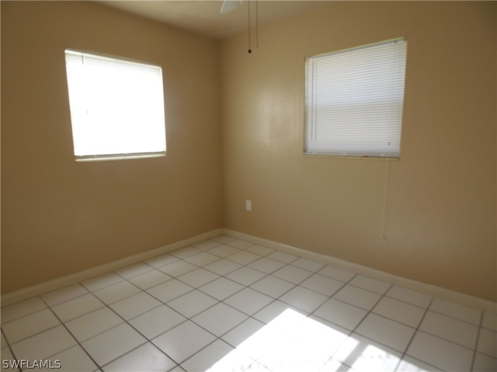 102 Alabama Road South Lehigh Acres, FL 33936 - Photo 16 of 24 an empty room with a window