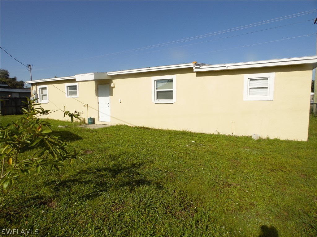 102 Alabama Road South Lehigh Acres, FL 33936 - Photo 2 of 24 a view of a big room with an outdoor space