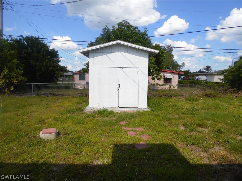 102 Alabama Road South Lehigh Acres, FL 33936 - Photo 24 of 24 a view of a backyard with a garden and plants