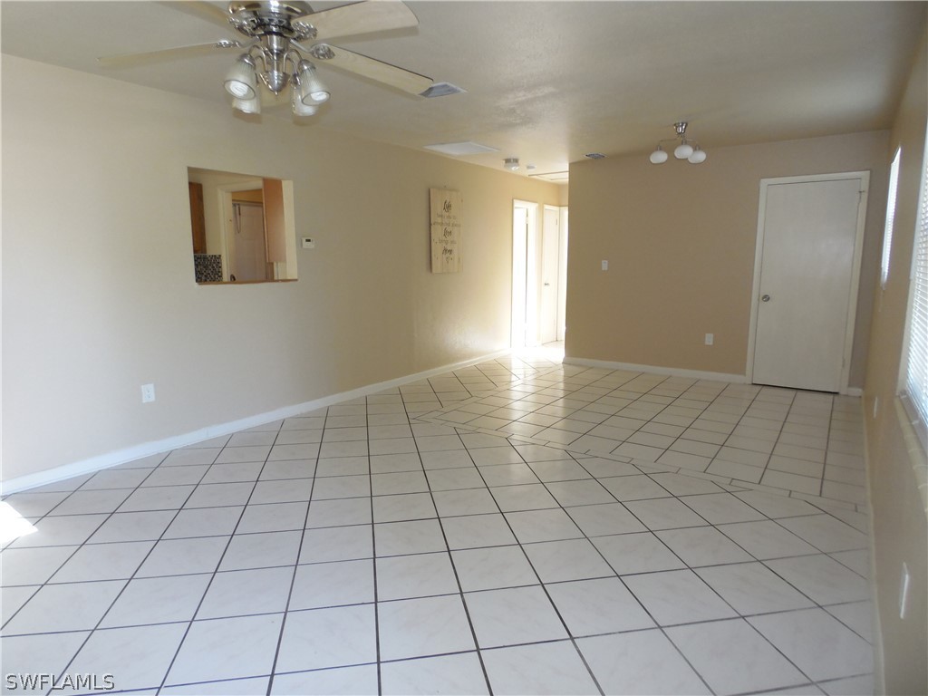 102 Alabama Road South Lehigh Acres, FL 33936 - Photo 3 of 24 a view of an empty room and window