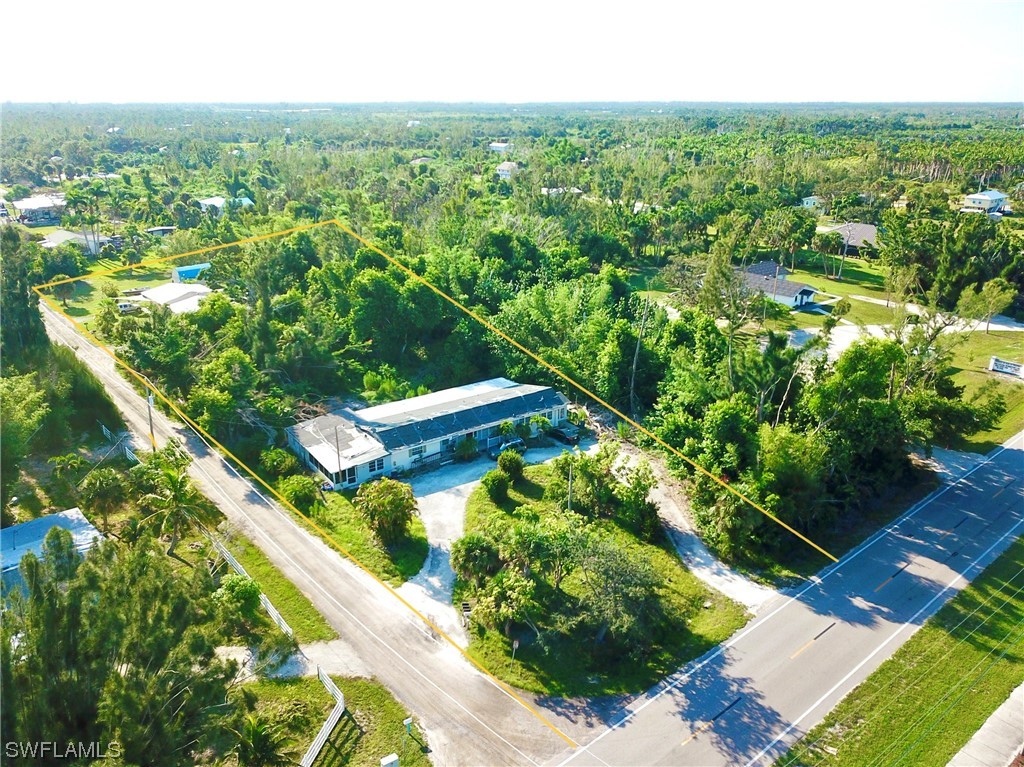 7431 Ontario Road Bokeelia, FL 33922 - Photo 3 of 16 a view of a garden with plants