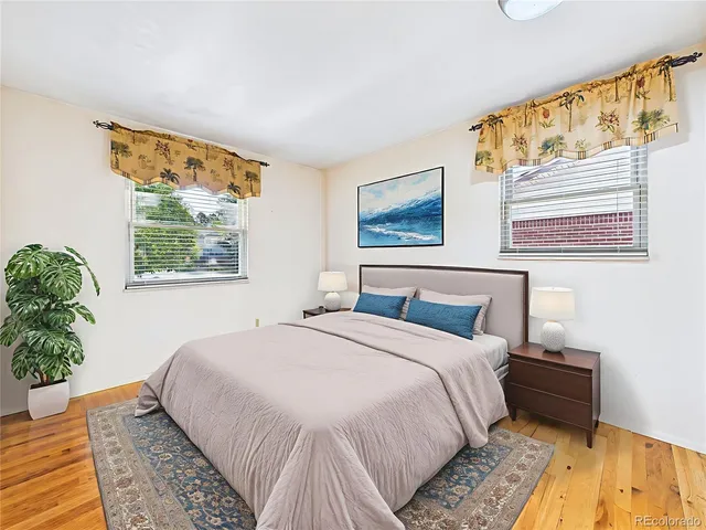 a spacious bathroom with a sink a toilet and a mirror
