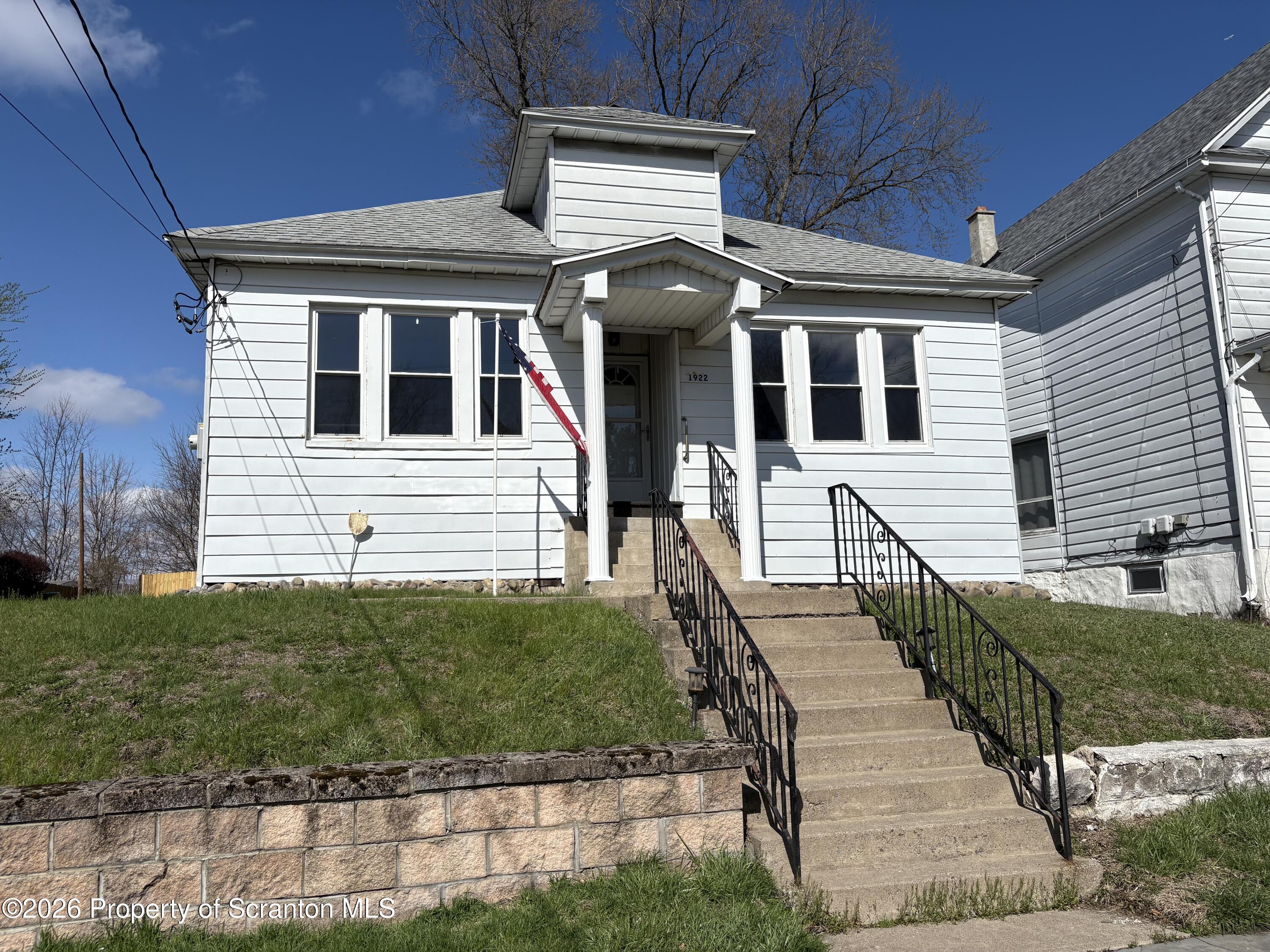 1922 Lafayette Street Scranton, PA 18504 - Photo 2 of 14 a front view of a house with a yard